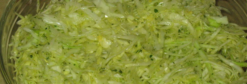 Cabbage salad is served on the table.