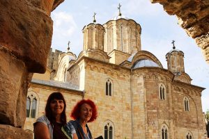 Ladies are posing in front of the Manasija monastery.