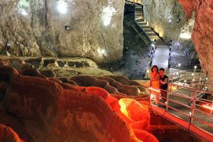 Girls are posing in Stopica cave on their Serbia vacation package tour.