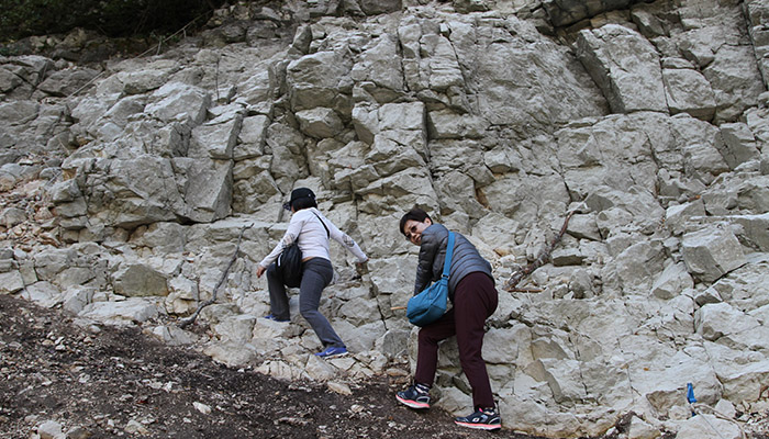 After Uvac boat ride tourists are climbing the rocks.