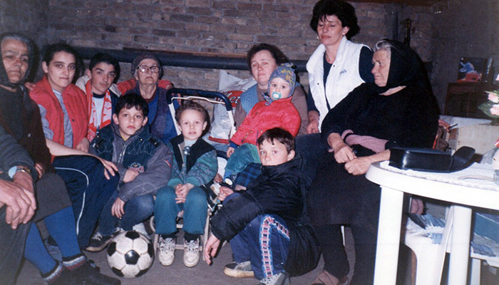 People are hiding in the basement during the NATO bombing of Serbia.